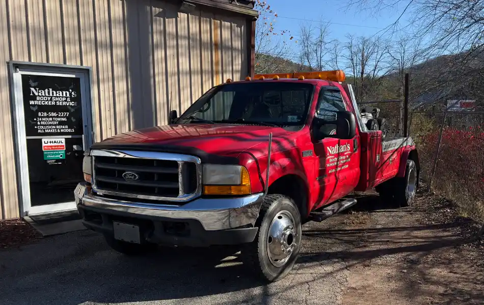 Towing in Sylva NC tow truck in parking lot, part of Nathan’s Body Shop & Wrecker Service fleet serving Jackson County NC and surrounding areas.