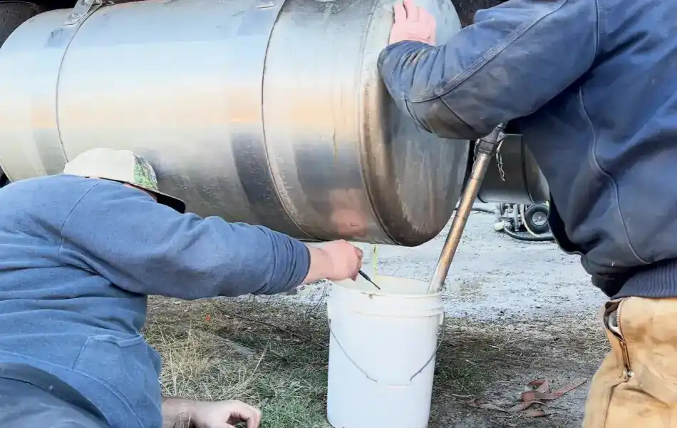 Emptying tractor trailer fuel tank during diesel spill cleanup.