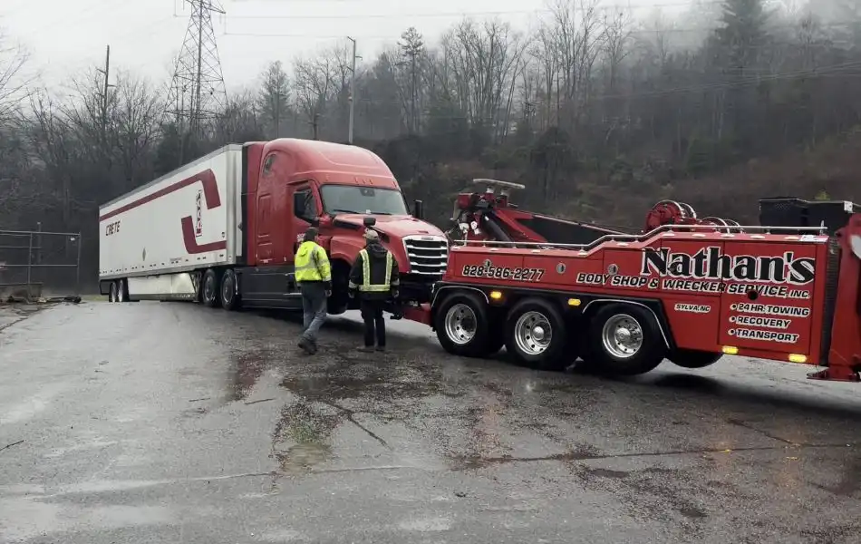 Heavy duty towing of a semi truck by Nathan’s Body Shop & Wrecker Service in Western NC