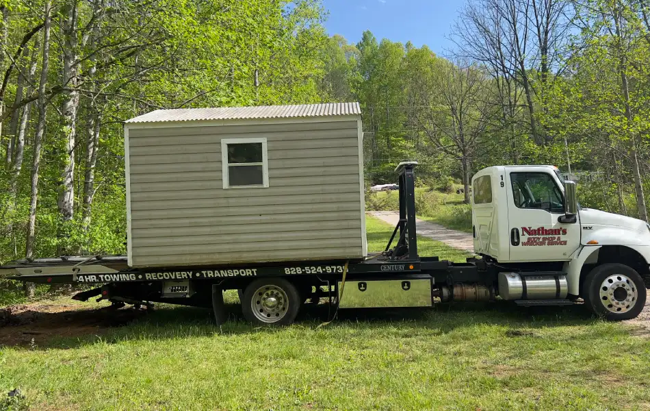 Shed Flatbed Towing – Nathan’s Body Shop & Wrecker Service Flatbed Towing small shed by Nathan’s Body Shop & Wrecker Service in Franklin NC
